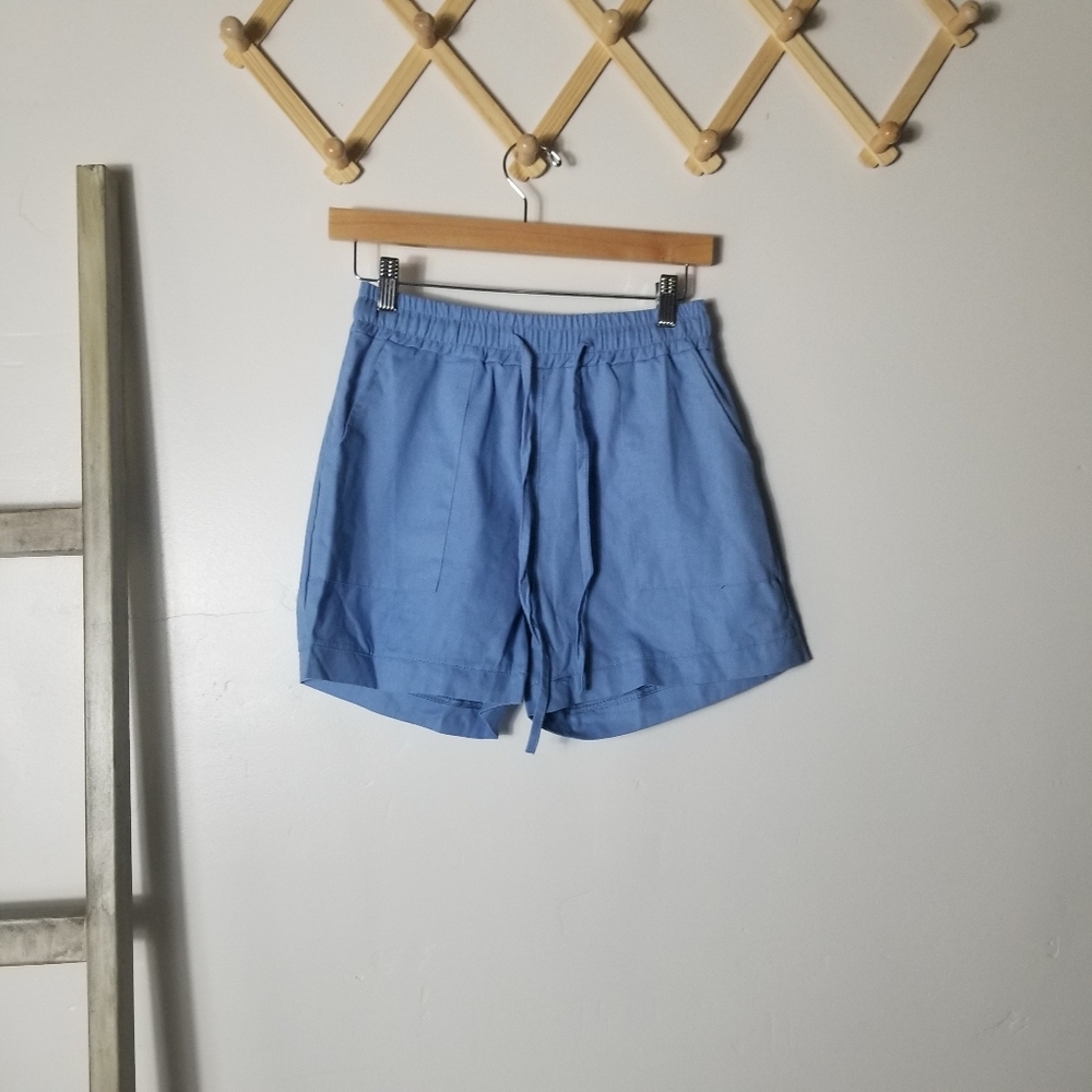 NWOT WOMEN'S BLUE SHORTS SIZE LARGE (RUNS SMALL)